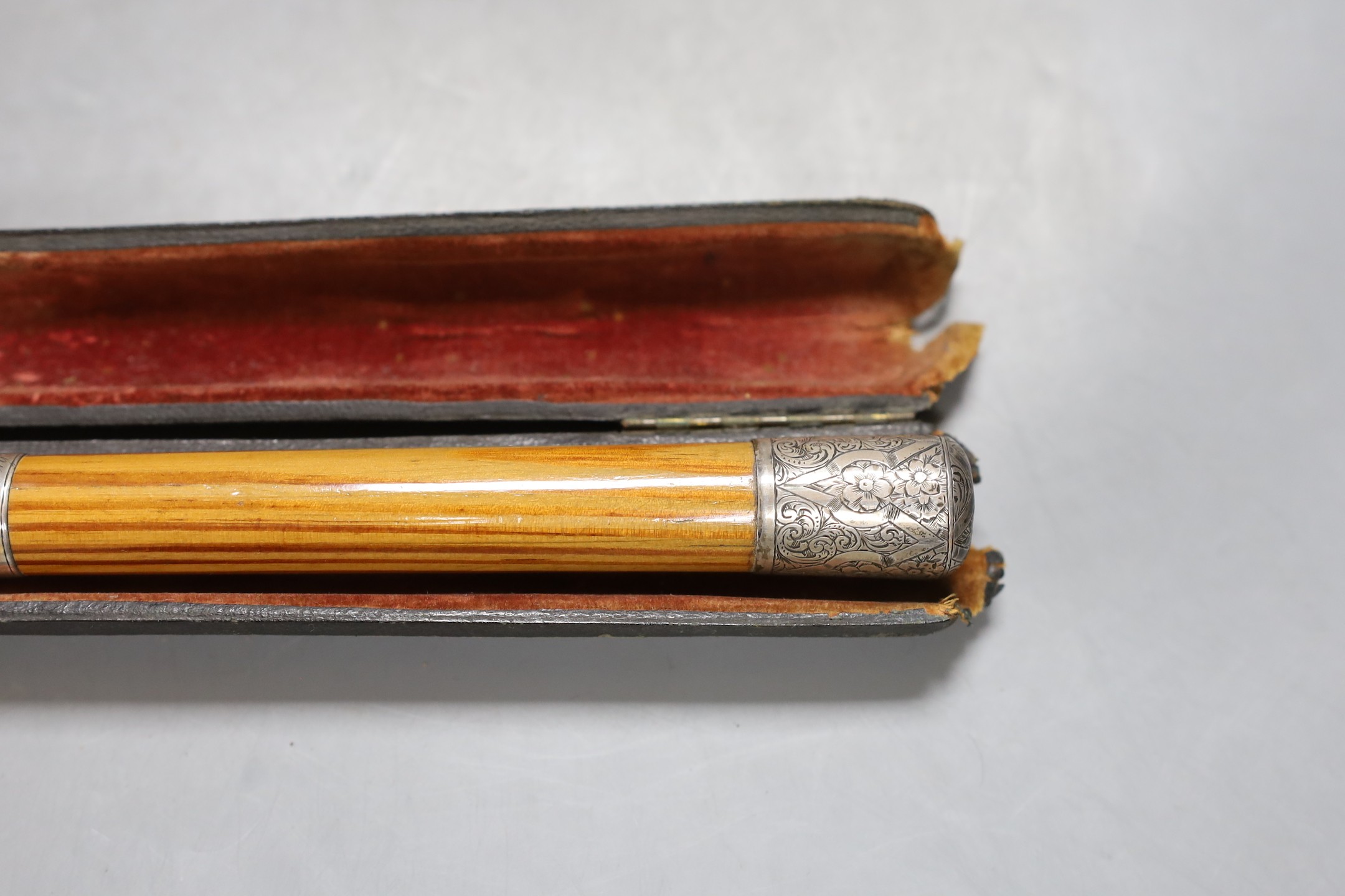 A cased presentation conductors baton, baton 51.5 cms long.